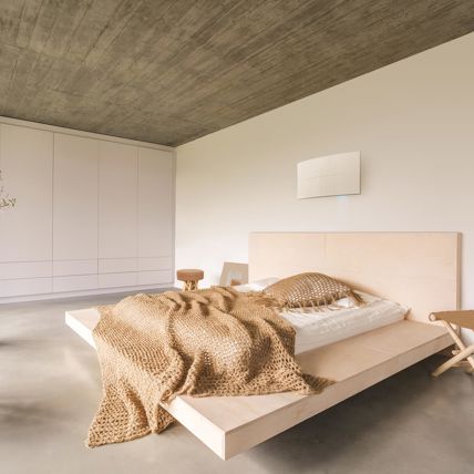 Sistema di ventilazione a parete Flow Elite in una camera da letto
